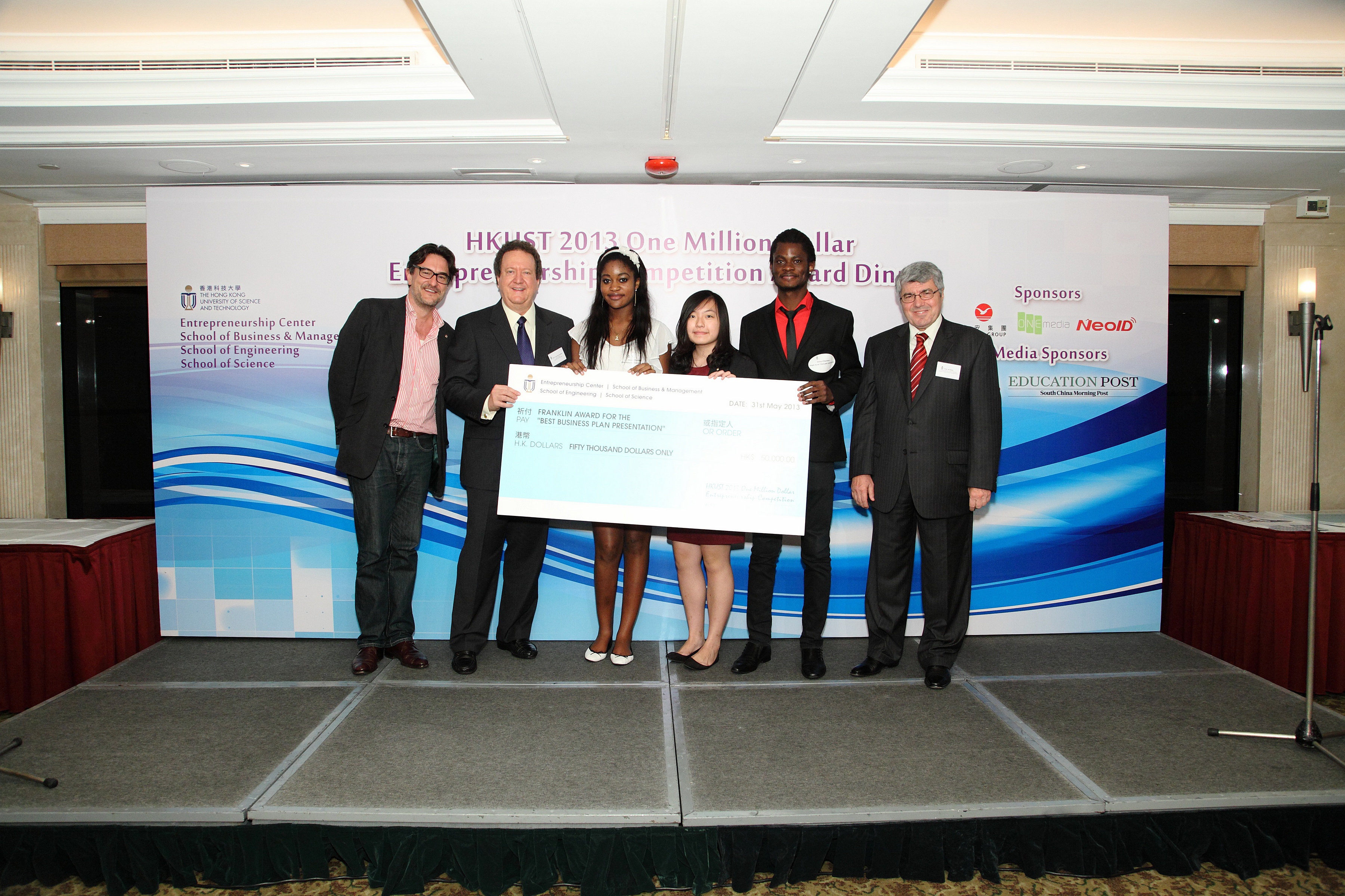 Prof Laurence Franklin (second from left), who initiated the new Franklin Award for the Best Business Plan Presentation, presents the award to Inno-Chemos (International) Technology Limited.